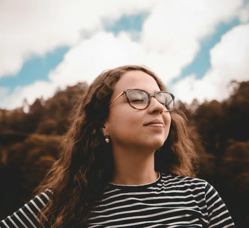 Person on a mountain at sunset, representing experiencing God